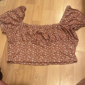 reddish brown flowery tshirt/ off the shoulder